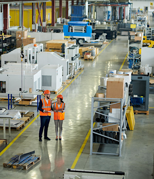 Two people in a factory